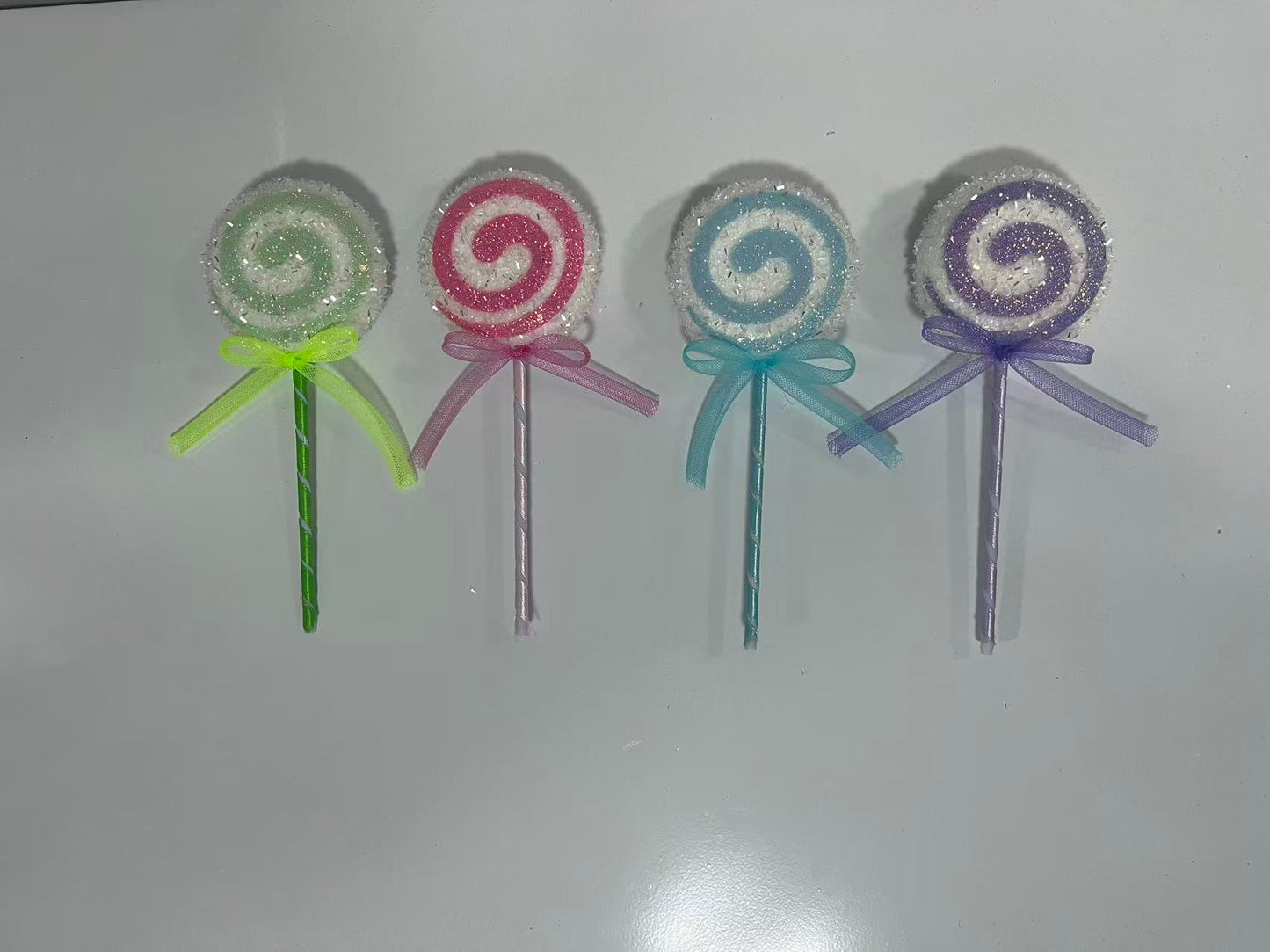 Large handcrafted foam lollipop Christmas ornaments with glitter finish, ideal for giant candy-themed tree decorations and commercial holiday window displays, factory direct supply.