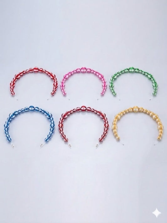A collection of six striped silk-wrapped bead strands in various colors including red, pink, green, blue, dark red, and gold, featuring hand-wound satin textures for professional Christmas decor and DIY crafts.